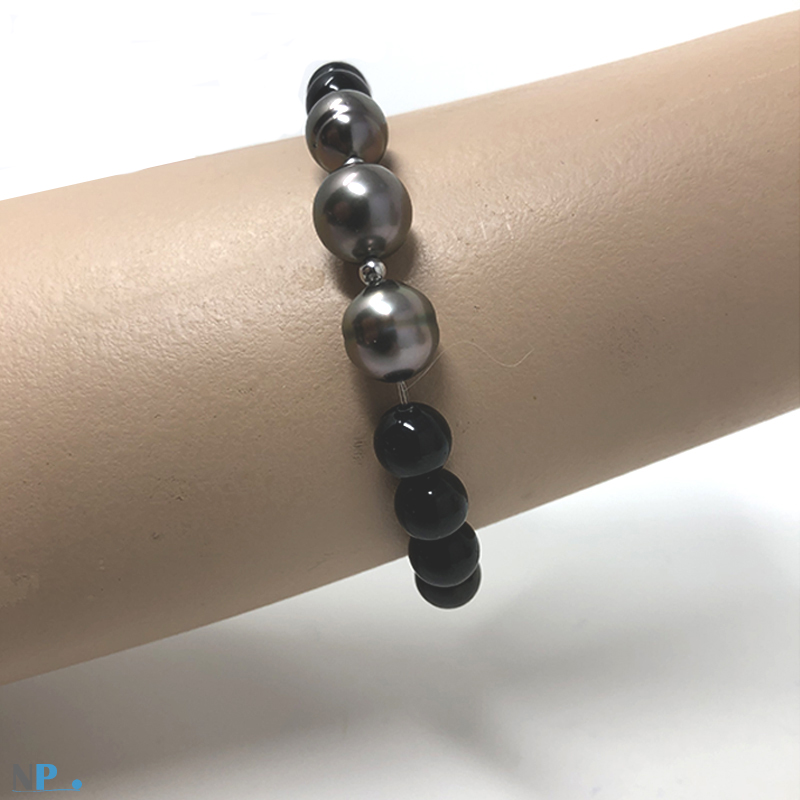 Bracelet de pierres semi-précieuses Obsidiennes et 3 jolies perles de Tahiti separees par des billes d'or