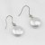 Boucles d'oreilles de perles d'eau douce plates blanches de 12-13 mm