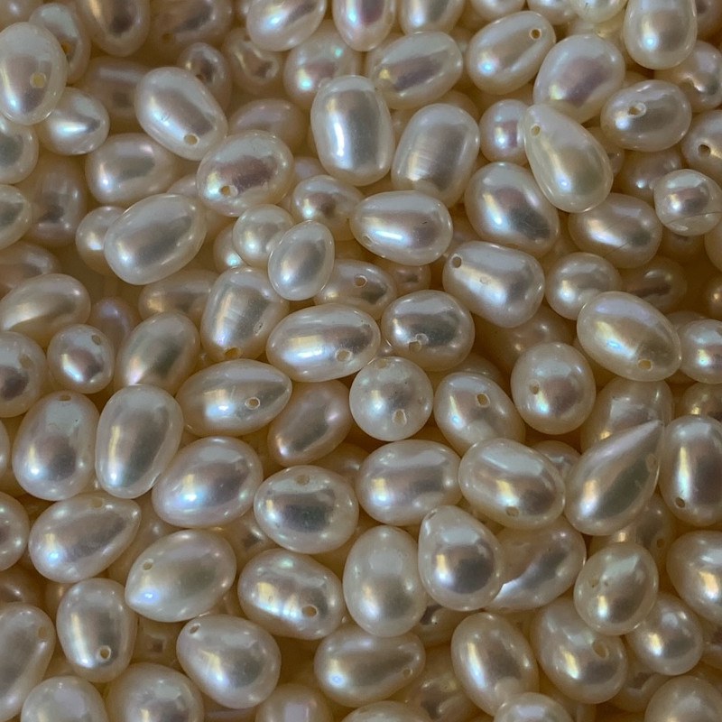 Lot de 20 perles d'eau douce grains de riz blanches 6x7,5 mm ovales percées transversalement