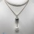 Pendentif perle noire de Tahiti - Perle blanche d'Australie - Or 18 carats