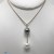 Pendentif perle noire de Tahiti - Perle blanche d'Australie - Or 18 carats